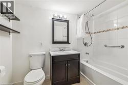 Bathroom with vanity and shower / bath combination - 