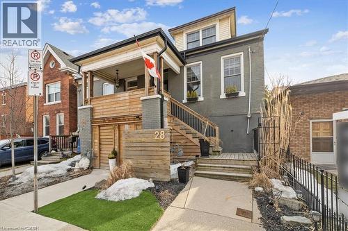 View of front of home with brick siding and stairs - 28 Grove Street, Hamilton, ON - Outdoor