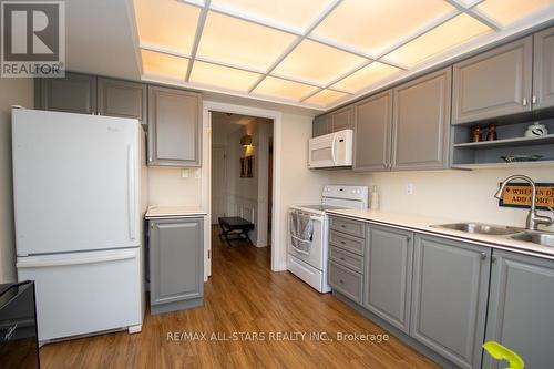 408 - 50 Rivermill Boulevard, Kawartha Lakes (Lindsay), ON - Indoor Photo Showing Kitchen With Double Sink