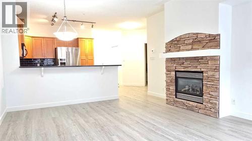 201, 10 Discovery Ridge Close Sw, Calgary, AB - Indoor With Fireplace