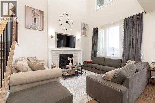 344 Rivergrove Chase W, Lethbridge, AB - Indoor Photo Showing Living Room With Fireplace