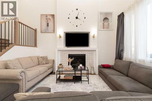 344 Rivergrove Chase W, Lethbridge, AB - Indoor Photo Showing Living Room With Fireplace