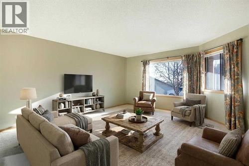 Virtual Staging - Living Room - 8, 118 Strathcona Road Sw, Calgary, AB - Indoor Photo Showing Living Room