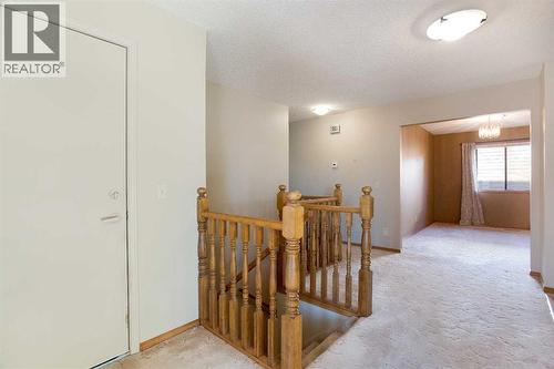 8, 118 Strathcona Road Sw, Calgary, AB - Indoor Photo Showing Other Room