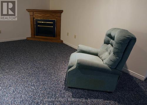 Recreation room - Electric fireplace - 2125 Lynn Heights Drive, Pickering, ON - Indoor Photo Showing Living Room With Fireplace