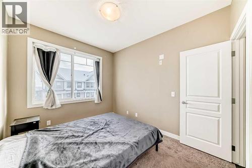 312, 48 Panatella Road Nw, Calgary, AB - Indoor Photo Showing Bedroom