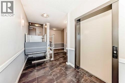 312, 48 Panatella Road Nw, Calgary, AB - Indoor Photo Showing Laundry Room