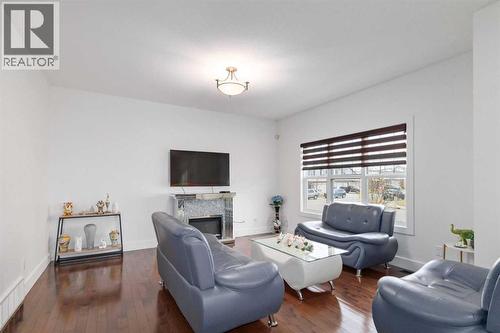 110 Merganser Crescent, Fort Mcmurray, AB - Indoor Photo Showing Living Room With Fireplace