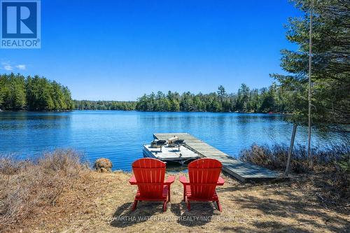 Summer at the Dock - 1170 English Circle, Highlands East (Glamorgan), ON - Outdoor With Body Of Water With View