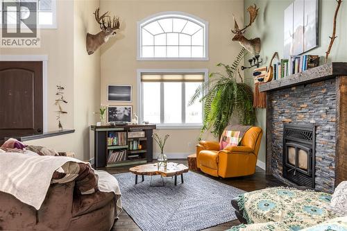 12 Vickar Place, Melfort, SK - Indoor Photo Showing Living Room With Fireplace