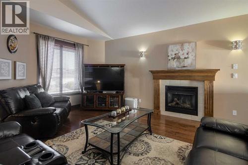 380 Grizzly Crescent N, Lethbridge, AB - Indoor Photo Showing Living Room With Fireplace