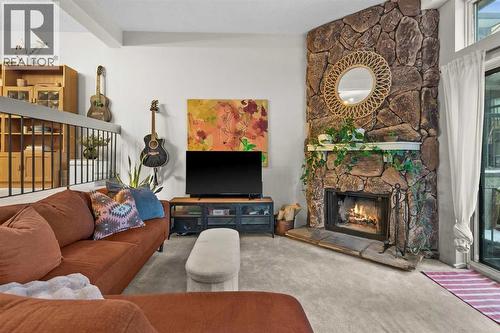 505, 3131 63 Avenue Sw, Calgary, AB - Indoor Photo Showing Living Room With Fireplace