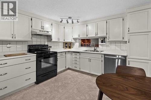 505, 3131 63 Avenue Sw, Calgary, AB - Indoor Photo Showing Kitchen With Double Sink