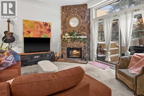 505, 3131 63 Avenue Sw, Calgary, AB - Indoor Photo Showing Living Room With Fireplace