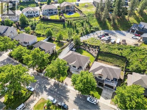 Exterior landscaping has been digitally enhanced to reflect summer conditions. Photos were taken during the winter season. - 867 Steele Road, Kelowna, BC - Outdoor With View