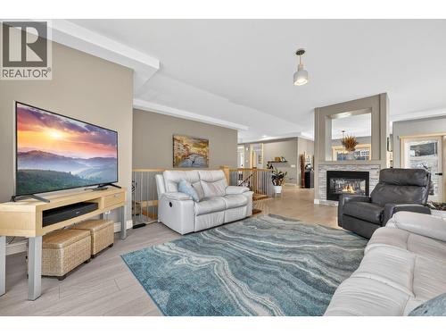 Living room - 867 Steele Road, Kelowna, BC - Indoor Photo Showing Living Room With Fireplace