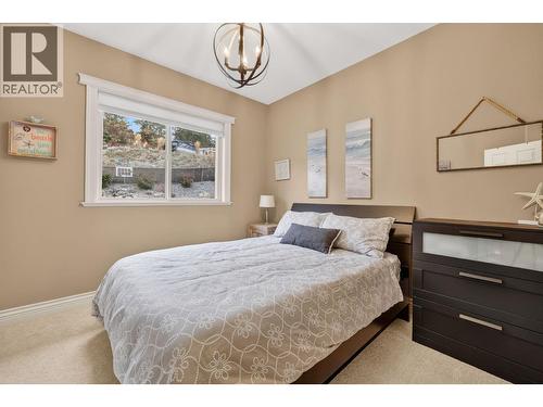 Second bedroom on the main floor - 867 Steele Road, Kelowna, BC - Indoor Photo Showing Bedroom