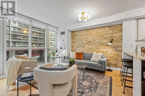Huge Living Room with gorgeous stone accent wall! - 328 - 25 Carlton Street, Toronto, ON - Indoor Photo Showing Living Room