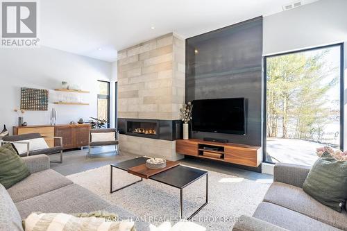 3870 Darling Island Road, Severn, ON - Indoor Photo Showing Living Room With Fireplace