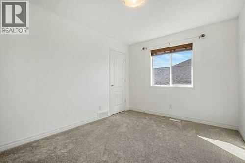 Bedroom 2 - 345 Prestwick Terrace Se, Calgary, AB - Indoor Photo Showing Other Room