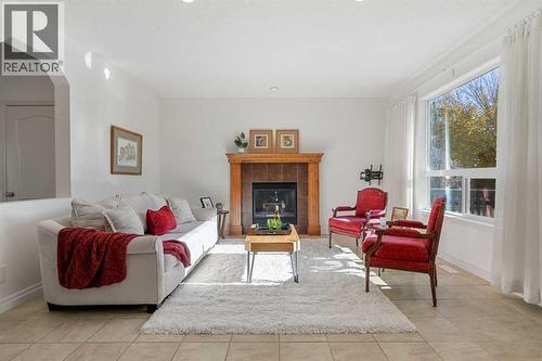 345 Prestwick Terrace Se, Calgary, AB - Indoor Photo Showing Living Room With Fireplace