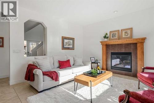 345 Prestwick Terrace Se, Calgary, AB - Indoor Photo Showing Living Room With Fireplace