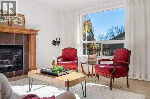 345 Prestwick Terrace Se, Calgary, AB - Indoor Photo Showing Living Room With Fireplace