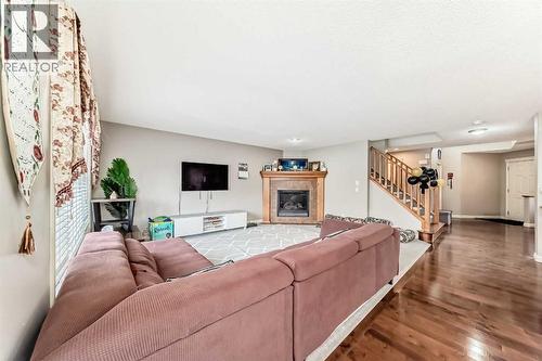 2468 Kingsland View Se, Airdrie, AB - Indoor Photo Showing Living Room With Fireplace