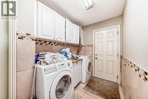 2468 Kingsland View Se, Airdrie, AB - Indoor Photo Showing Laundry Room
