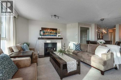 1109, 804 3 Avenue Sw, Calgary, AB - Indoor Photo Showing Living Room With Fireplace