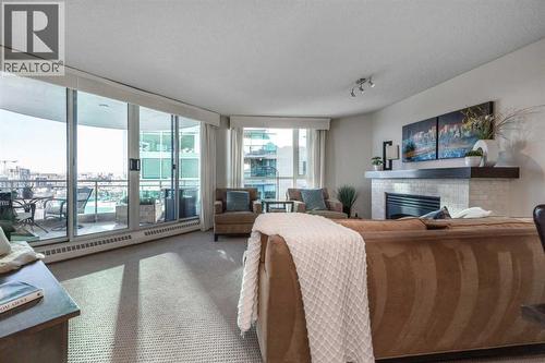 1109, 804 3 Avenue Sw, Calgary, AB - Indoor Photo Showing Living Room With Fireplace