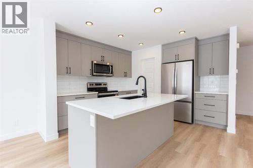12 Trinity Street, Lacombe, AB - Indoor Photo Showing Kitchen With Stainless Steel Kitchen With Upgraded Kitchen