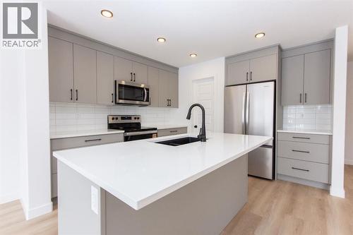 12 Trinity Street, Lacombe, AB - Indoor Photo Showing Kitchen With Stainless Steel Kitchen With Upgraded Kitchen