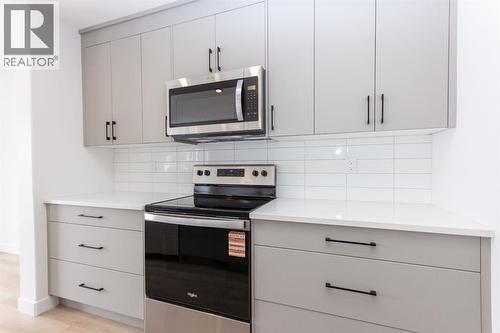 12 Trinity Street, Lacombe, AB - Indoor Photo Showing Kitchen With Upgraded Kitchen
