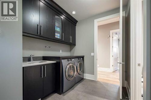 16 Spring Valley Way Sw, Calgary, AB - Indoor Photo Showing Laundry Room