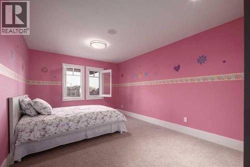 16 Spring Valley Way Sw, Calgary, AB - Indoor Photo Showing Bedroom