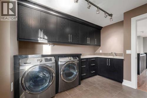 16 Spring Valley Way Sw, Calgary, AB - Indoor Photo Showing Laundry Room