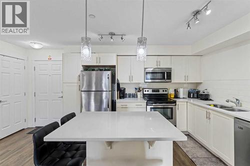 2313, 99 Copperstone Park Se, Calgary, AB - Indoor Photo Showing Kitchen With Double Sink With Upgraded Kitchen