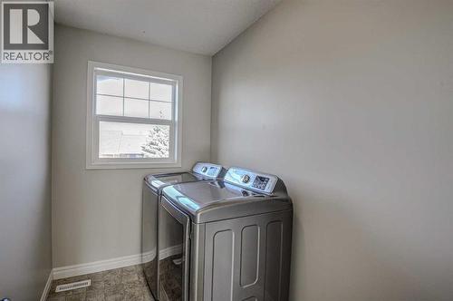 40 Prestwick Manor Se, Calgary, AB - Indoor Photo Showing Laundry Room