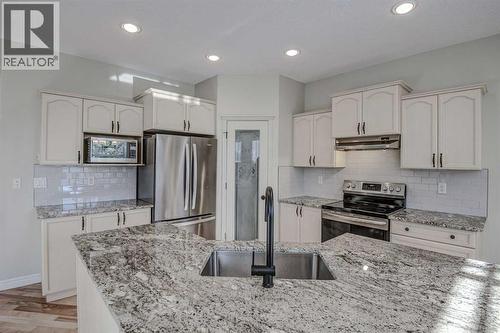 40 Prestwick Manor Se, Calgary, AB - Indoor Photo Showing Kitchen With Double Sink With Upgraded Kitchen