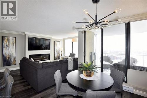 75 Queen Street N Unit# 1707, Hamilton, ON - Indoor Photo Showing Dining Room With Fireplace