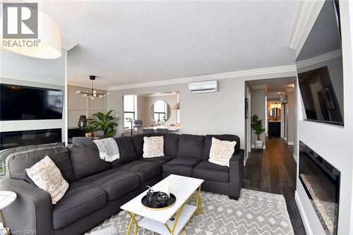 75 Queen Street N Unit# 1707, Hamilton, ON - Indoor Photo Showing Living Room With Fireplace