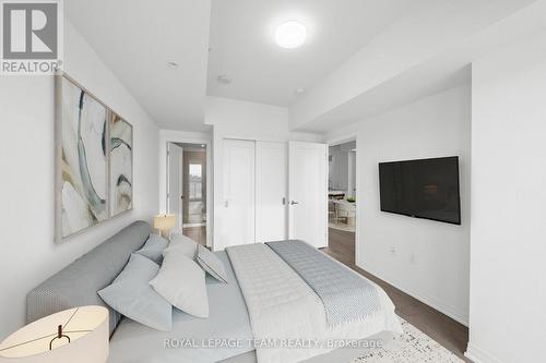 This photograph has been virtually staged. - 906 - 805 Carling Avenue, Ottawa, ON - Indoor Photo Showing Bedroom
