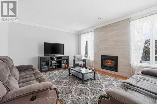 2104 Sandy Oaks Drive, Ottawa, ON - Indoor Photo Showing Living Room With Fireplace