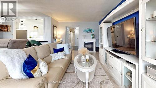 1219 - 551 The West Mall, Toronto, ON - Indoor Photo Showing Living Room With Fireplace