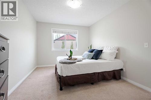 3005 Windsong Boulevard Sw, Airdrie, AB - Indoor Photo Showing Bedroom