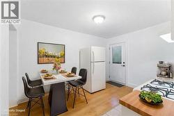 Dining space with baseboards and light wood-style floors - 