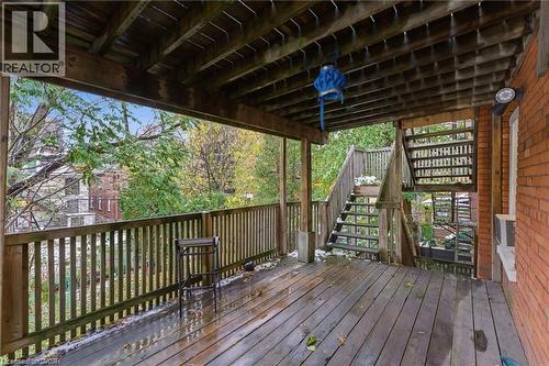 Wooden deck featuring stairway - 180 Emerald Street S, Hamilton, ON - Outdoor With Deck Patio Veranda