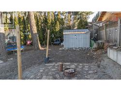Partially fenced yard with fire pit Creston - 