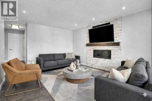 33 Douglasbank Rise Se, Calgary, AB - Indoor Photo Showing Living Room With Fireplace